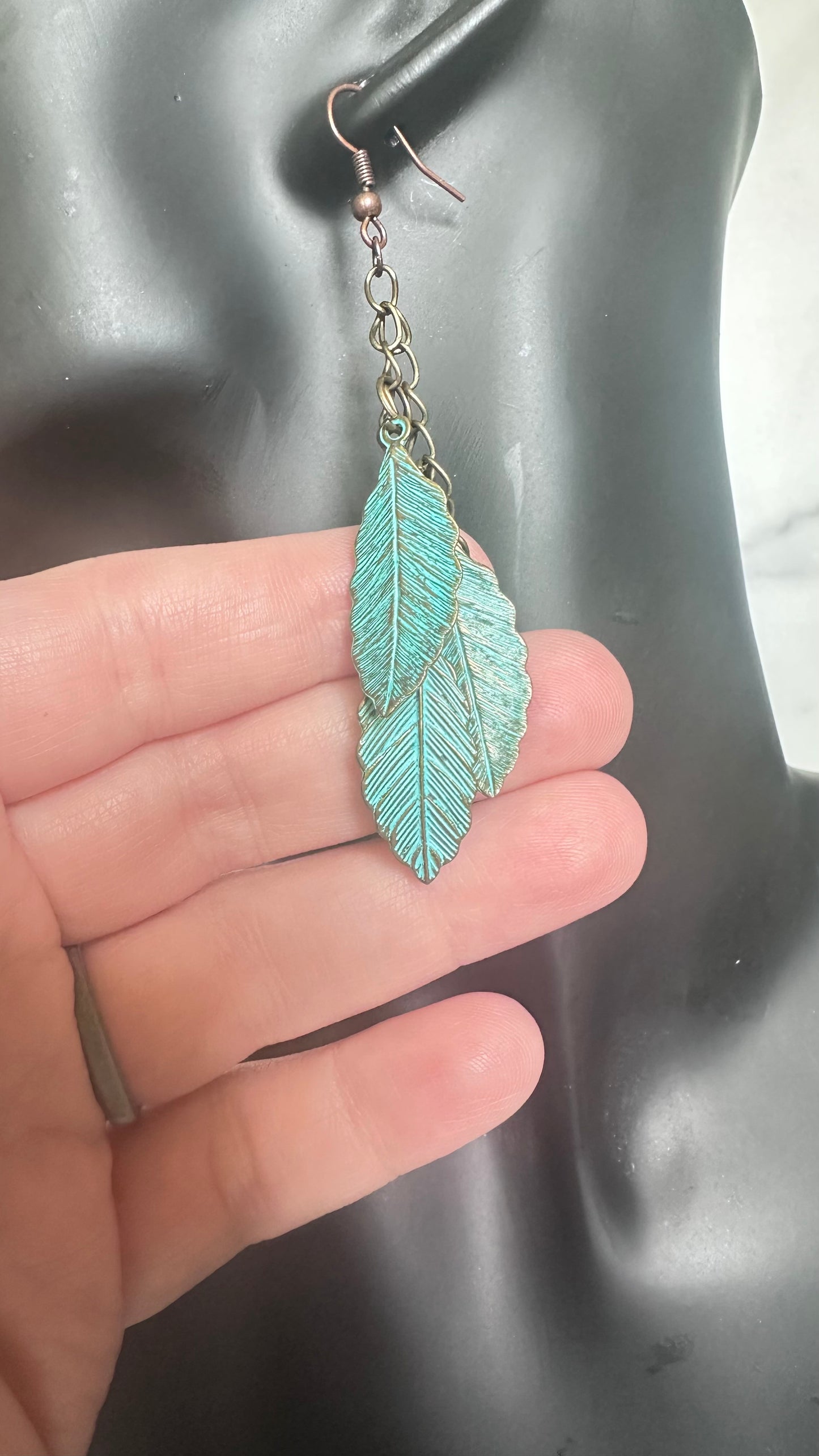 Blue metal feather earrings