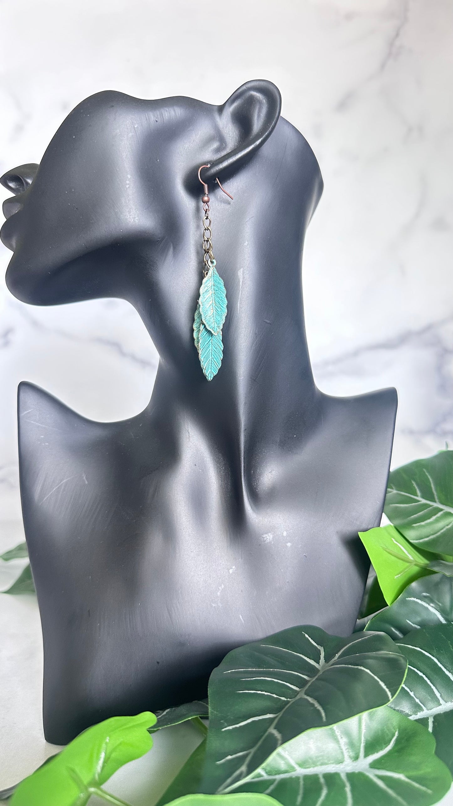 Blue metal feather earrings