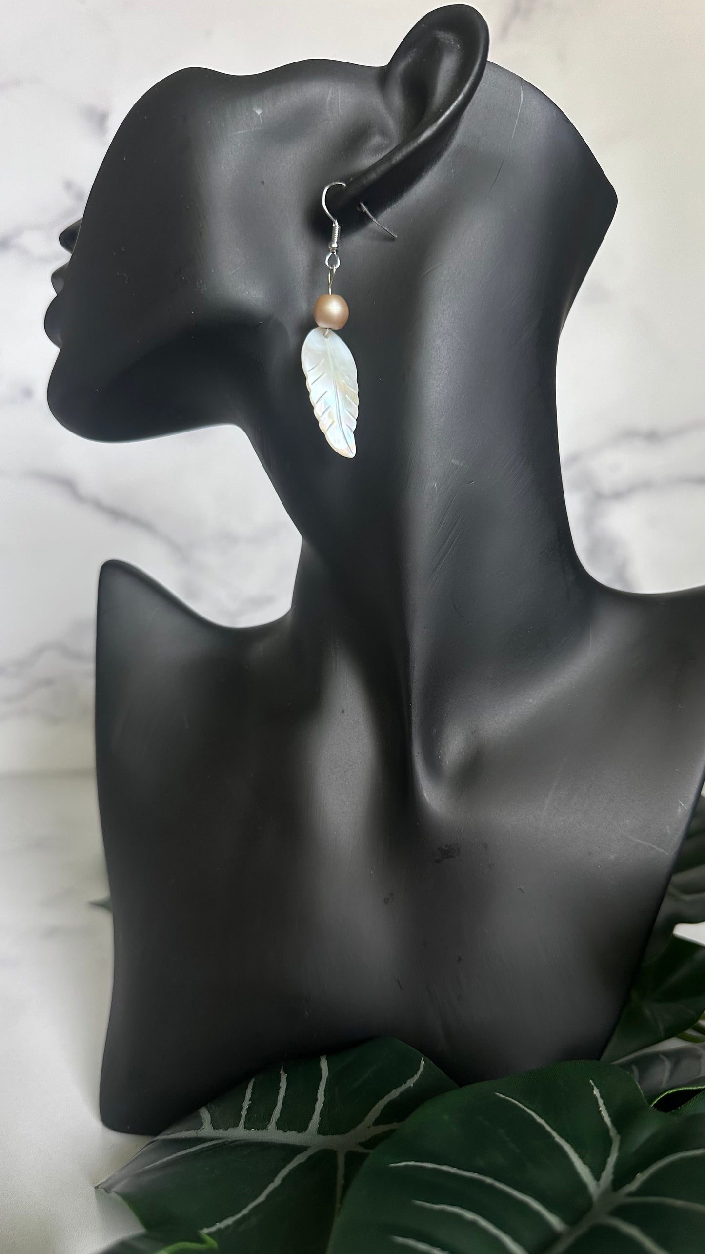 Pearlescent white feather earrings